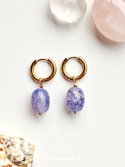 Oorbellen van grote glaskralen