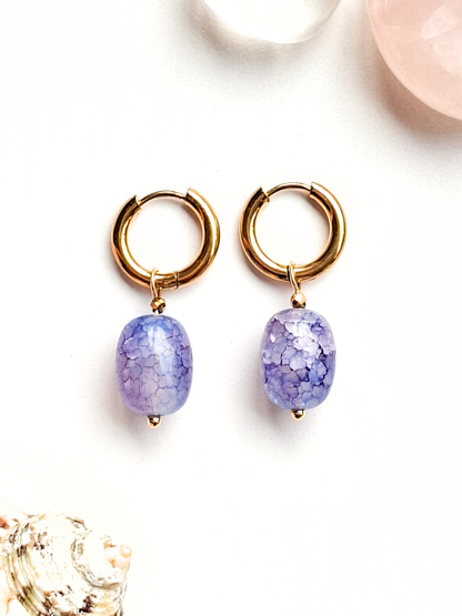 Oorbellen van grote glaskralen